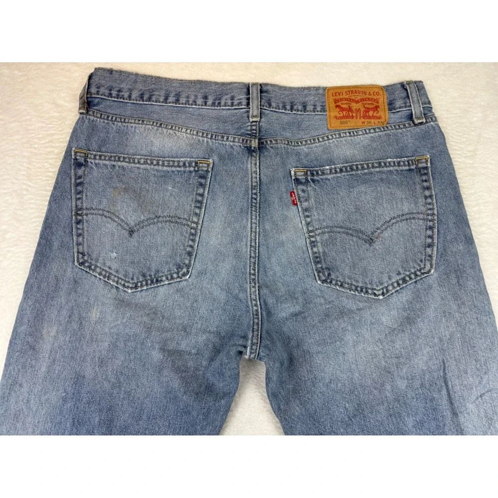 Levis 505 Mens 36x34 Jeans Light Blue Wash Denim Grungy HighLow Fade ripped Hem